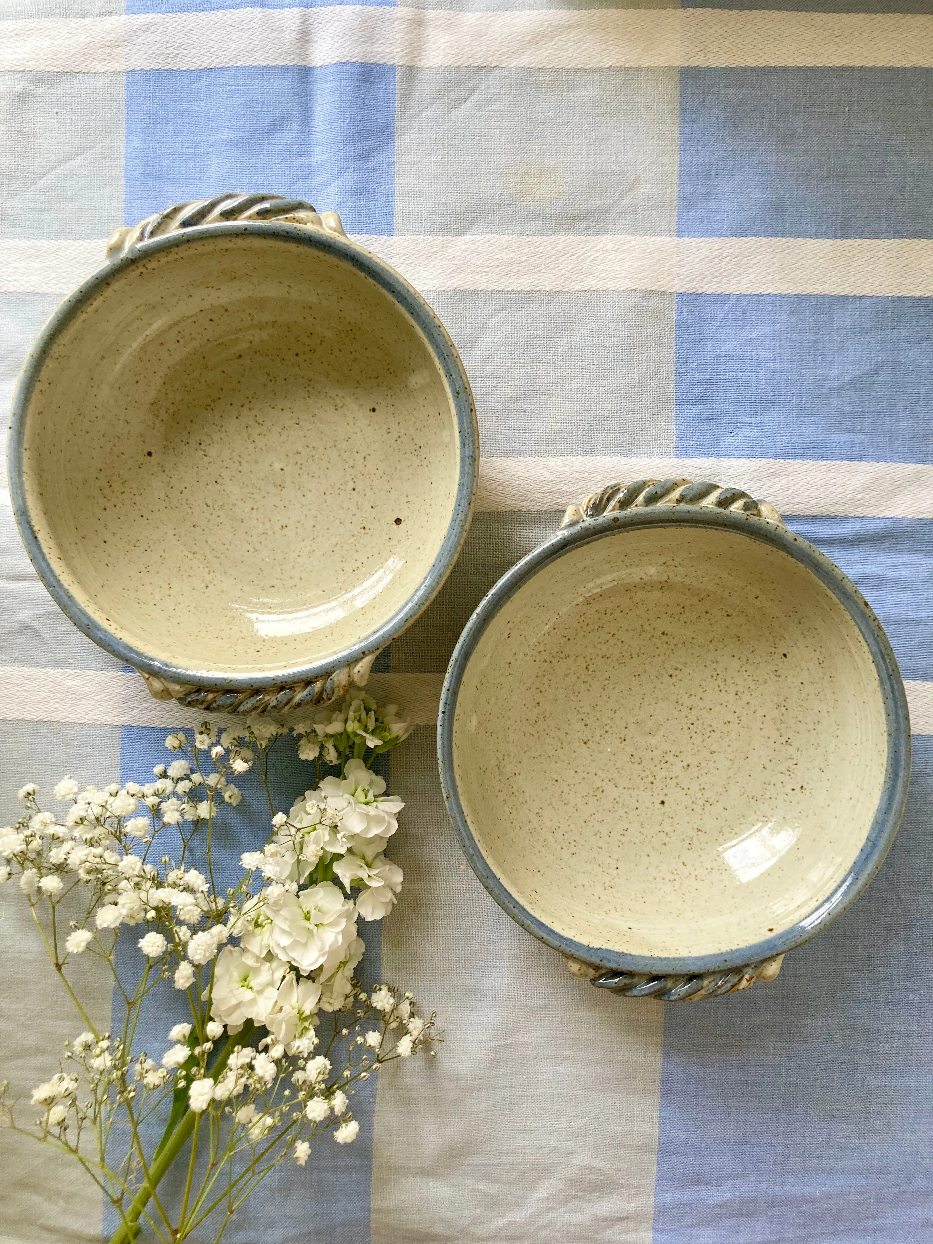 A pair of stoneware studio pottery bowls